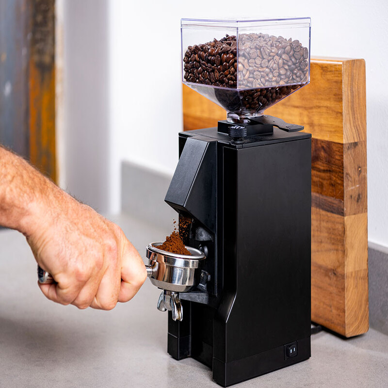 grind espresso beans in a coffee grinder